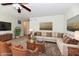 Cozy staged living room with comfortable seating, rug, and stylish decor at 888 Streamside Dr, Greenfield, IN 46140