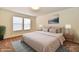 Relaxing main bedroom with a plush bed, decorative lamps, and neutral colored decor at 888 Streamside Dr, Greenfield, IN 46140