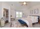 Bright bedroom with large bed, accent rug, and a window providing lots of natural light at 9011 Harrison Run Dr, Indianapolis, IN 46256