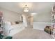 Inviting bedroom featuring a trundle bed and book shelves for ample storage and reading space at 9011 Harrison Run Dr, Indianapolis, IN 46256