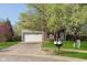 Inviting home with a two-car garage, lush lawn, and mature trees in a desirable neighborhood at 9011 Harrison Run Dr, Indianapolis, IN 46256