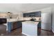 Open concept kitchen featuring stainless steel appliances, an island, and easy access to the living area at 9011 Harrison Run Dr, Indianapolis, IN 46256