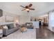 Open living room with ceiling fan, recessed lights, and comfortable seating arrangement at 9011 Harrison Run Dr, Indianapolis, IN 46256