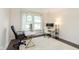 Bright home office featuring two desks, modern decor, and a large window for natural light at 9011 Harrison Run Dr, Indianapolis, IN 46256