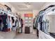 Spacious walk-in closet with ample storage shelves and hanging racks for organization at 9011 Harrison Run Dr, Indianapolis, IN 46256