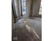 Empty living room with neutral carpet and a window offering natural light and view of the neighborhood at 9278 S Geneva Rd, Flat Rock, IN 47234