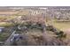 Wide aerial shot showcases the neighborhood, trees and homes at 9531 Prospect St, Indianapolis, IN 46239
