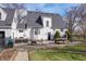 Exterior of backyard showcasing brick patio with outdoor furniture, and well manicured lawn at 9531 Prospect St, Indianapolis, IN 46239
