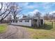 Exterior view of barn with sliding doors surrounded by green grass at 9531 Prospect St, Indianapolis, IN 46239