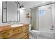 Stylish bathroom with a vintage vanity, subway tile shower, and modern fixtures at 9531 Prospect St, Indianapolis, IN 46239