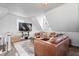 Cozy living room with modern leather sofa and stylish decor atop a decorative area rug at 9531 Prospect St, Indianapolis, IN 46239