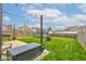 A well-kept backyard is great for outdoor play with a patio and trampoline at 1012 Balto Dr, Shelbyville, IN 46176