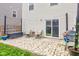 Paver patio featuring outdoor furniture, a grill, and string lights in the backyard at 1012 Balto Dr, Shelbyville, IN 46176