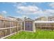 A well-maintained backyard features a storage shed and plenty of green space at 1012 Balto Dr, Shelbyville, IN 46176