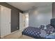 Comfortable bedroom with two closets, a full-sized bed, and neutral walls, creating a peaceful atmosphere at 1012 Balto Dr, Shelbyville, IN 46176