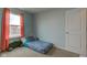 Bright bedroom with a full-sized bed, window, and neutral walls, creating a peaceful atmosphere at 1012 Balto Dr, Shelbyville, IN 46176