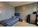 Relaxing bedroom with a full-sized bed, matching blue furniture, and soft lighting for a cozy ambiance at 1012 Balto Dr, Shelbyville, IN 46176