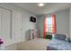 Bright bedroom with a full-sized bed, closet, and a cozy window nook that offers a relaxing retreat at 1012 Balto Dr, Shelbyville, IN 46176