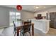 Dining room showcasing a wooden table and chairs, with views to the backyard through sliding glass doors at 1012 Balto Dr, Shelbyville, IN 46176