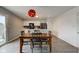 Open-concept dining room boasts a wooden table set, with an adjacent kitchen featuring stainless steel appliances at 1012 Balto Dr, Shelbyville, IN 46176