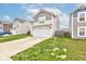Well-maintained two-story home with a two-car garage, green lawn, and classic siding at 1012 Balto Dr, Shelbyville, IN 46176