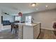 Kitchen island view showcases dining and living areas, fostering an inclusive living space at 1012 Balto Dr, Shelbyville, IN 46176