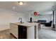 Open kitchen island with sleek appliances, view to dining, and modern living room, great for entertaining at 1012 Balto Dr, Shelbyville, IN 46176