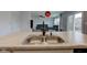 Modern kitchen featuring a stainless steel sink and faucet set in an open concept home design at 1012 Balto Dr, Shelbyville, IN 46176
