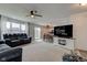 Open-concept living room with sofas, TV, and adjacent dining area, perfect for entertaining at 1012 Balto Dr, Shelbyville, IN 46176