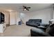Cozy living room with comfortable seating, neutral walls, and a view of the staircase at 1012 Balto Dr, Shelbyville, IN 46176