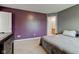 Charming main bedroom featuring a neutral carpet, adjacent to the primary bath at 1012 Balto Dr, Shelbyville, IN 46176