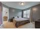 Spacious main bedroom featuring a large window and calming wall color at 1012 Balto Dr, Shelbyville, IN 46176