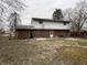 The backyard has a patio, lawn, and is surrounded by mature trees. A blank canvas ready for your vision! at 10131 Nassau Ln, Indianapolis, IN 46229