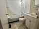 Clean bathroom shows a white vanity, toilet, and tub/shower combination with tile flooring at 10131 Nassau Ln, Indianapolis, IN 46229
