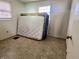Simple bedroom showcases a disused mattress leaning against the wall near a bright window at 10131 Nassau Ln, Indianapolis, IN 46229