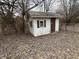 Exterior shot of an outbuilding surrounded by bare trees and leaves at 10131 Nassau Ln, Indianapolis, IN 46229