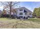 A spacious backyard with a fire pit, water feature, and lush landscaping for outdoor enjoyment at 10415 Charter Oaks, Carmel, IN 46032