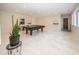 Finished basement boasts high ceilings, recessed lighting, and a sleek ping pong table, perfect for leisure and activities at 10415 Charter Oaks, Carmel, IN 46032