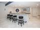 Finished basement bar area with seating, stylish decor, and ample counter space at 10415 Charter Oaks, Carmel, IN 46032