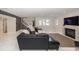 Spacious basement with a fireplace and a leather sectional sofa for relaxing or entertaining at 10415 Charter Oaks, Carmel, IN 46032