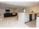Finished basement featuring an open layout with a kitchen, living area, and fireplace at 10415 Charter Oaks, Carmel, IN 46032