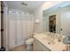 Well-maintained bathroom with a shower, toilet, vanity, and linen storage at 10415 Charter Oaks, Carmel, IN 46032