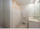Clean bathroom with a shower featuring a white shower curtain and neutral tile flooring at 10415 Charter Oaks, Carmel, IN 46032