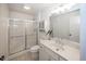 Classic bathroom with a glass-enclosed shower, vanity with sink, and neutral color palette at 10415 Charter Oaks, Carmel, IN 46032
