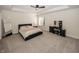 Bedroom showcasing a modern bed frame, makeup table, and plush gray carpeting at 10415 Charter Oaks, Carmel, IN 46032