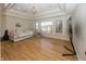 Bright bedroom with hardwood floors, a large window, and a minimalist design at 10415 Charter Oaks, Carmel, IN 46032