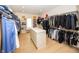 Spacious walk-in closet featuring hardwood floors, custom shelving, and ample storage at 10415 Charter Oaks, Carmel, IN 46032