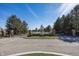 Gated community entrance featuring manicured landscaping, mature trees, and a secure entry system at 10415 Charter Oaks, Carmel, IN 46032