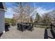 Spacious outdoor deck with a dining table, perfect for entertaining or enjoying a peaceful meal at 10415 Charter Oaks, Carmel, IN 46032
