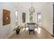 Bright breakfast nook area filled with natural light, hardwood floors and modern decor at 10415 Charter Oaks, Carmel, IN 46032